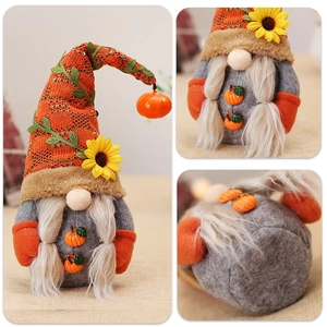 Macro detail of autumn gnome featuring knit hat with sunflower and small pumpkin charm
