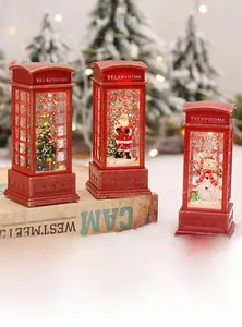 Close-up of red Christmas telephone booth lanterns with snow scene and LED lighting