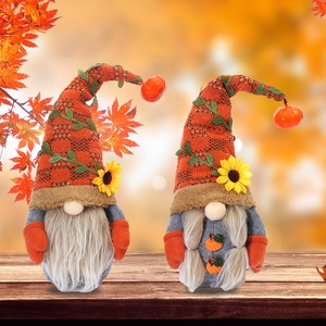 Fall harvest gnome couple figurines with sunflowers and mini pumpkins for home decor