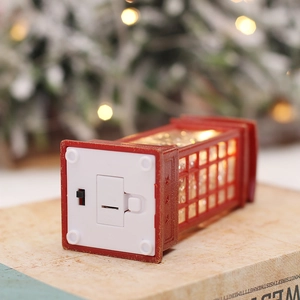 Red retro glowing telephone booth Christmas ornament with lighted base and power switch