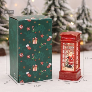 Lighted red Christmas telephone booth with Santa figure and festive gift packaging box