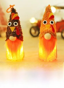 Close-up of Thanksgiving turkey gnome plush with glowing LED lights for home decor
