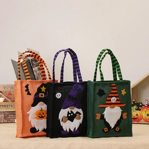 Three Halloween burlap gift bags with gnome wizard patterns and striped handles