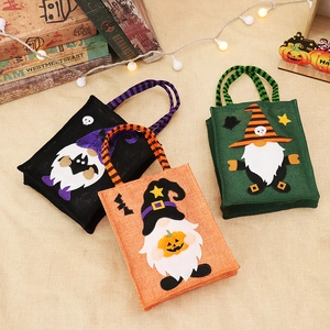 Three Halloween gnome linen gift bags with pumpkin and bat motifs for festive decoration