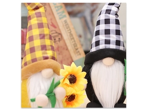 Macro view of sunflower gnome plush toys with plaid hats and soft white beards for decor