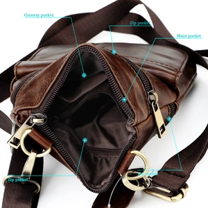 Detail view of the multi-compartment interior and leather texture of the brown crossbody bag