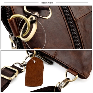 Macro detail of retro top grain leather texture and vintage brass hardware on shoulder bag