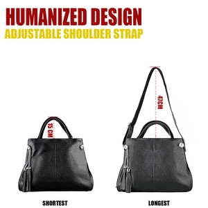 Detail of leather tote showing adjustable handle height and shoulder strap length