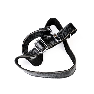 Detail of adjustable black leather strap with silver metal swivel hooks and pebble texture