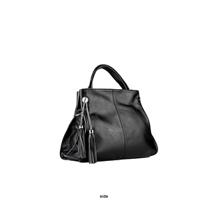 Close-up of black lychee-textured leather bag with silver chain and double tassels
