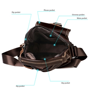 Dettaglio degli scomparti interni e delle tasche multiple con zip della borsa in pelle