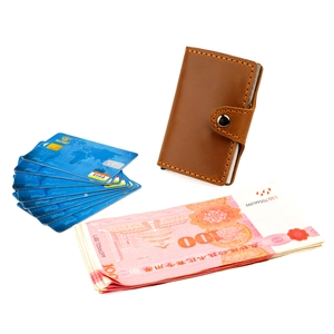 Brown vintage leather card wallet with contrast stitching and silver snap button closure