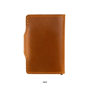 Detailed back view of vintage brown crazy horse leather wallet with yellow stitching