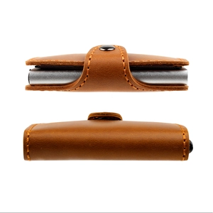 Detail view of brown crazy horse leather card holder with silver aluminum pop-up case