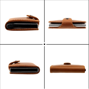 Detail view of brown leather wallet with silver aluminum card holder and snap closure