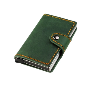 Detail of dark green crazy horse leather wallet with orange stitching and pop-up card slot