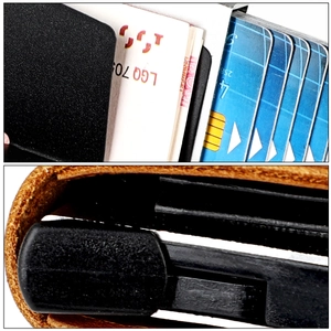 Close-up of brown crazy horse leather wallet with automatic aluminum pop-up card case