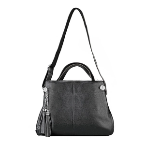Minimalist black leather handbag with litchi grain and stylish fringe detail in top view