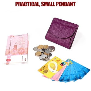 Mini purple pebble leather wallet showing compact storage for coins, cash, and cards