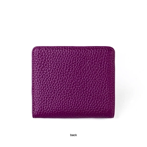 Back view of a mini purple leather wallet with a textured pebble grain finish