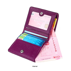 Detail view of purple pebbled leather wallet featuring RFID card slots and ID window