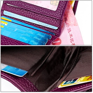 Detail view of purple lychee leather mini wallet with multiple card slots and bill compartment