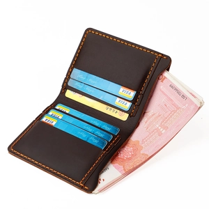 Detailed view of handmade dark brown crazy horse leather wallet with orange contrast stitching