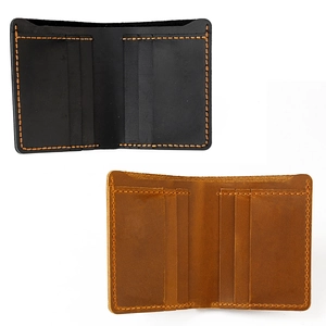 Detailed view of handmade crazy horse leather wallets with contrast stitching and card slots