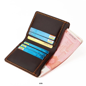 Detailed interior of vintage crazy horse leather wallet with cards slots and yellow stitching