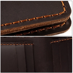 Detail of vintage coffee leather wallet with manual stitching and multiple card slots