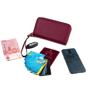 Deep red pebbled leather RFID wallet showing storage for passport, cards and large phone