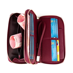 Detail view of burgundy RFID leather wallet with multiple card slots and zipper pocket