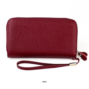 Back view of dark red pebble leather wallet featuring RFID blocking and gold zipper details