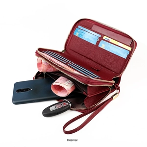 Internal view of wine red lychee leather wallet showing double zippers and card slots