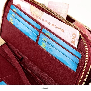 Detail view of wine red lychee leather wallet interior with eight functional card slots