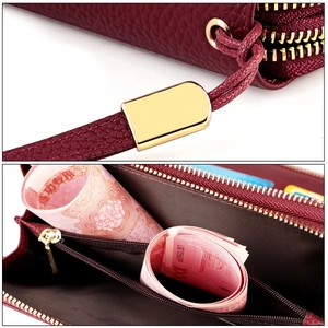 Detail of RFID wine red leather wallet featuring dual zippers and large inner capacity
