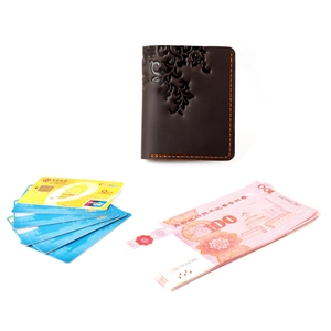 Vintage crazy horse leather wallet with embossed floral patterns and orange hand-stitching