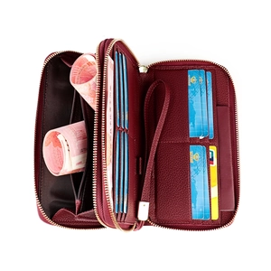 Burgundy RFID leather wallet with double zippers and 12 card slots in a flat lay view