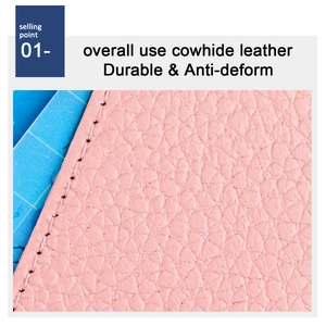 Macro shot of durable pink lychee grain cowhide leather with precise stitching detail