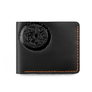 Detail of black leather bifold wallet with dragon totem embossing and orange stitching