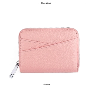 Detailed close-up of pink pebbled leather card holder with V-shaped slots and silver zipper