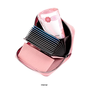 Internal view of pink leather card holder with accordion slots and silver zipper