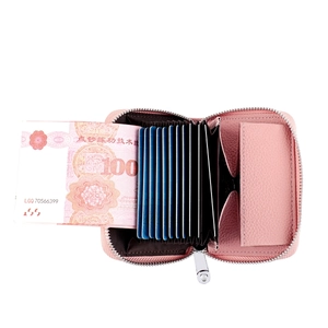 Pink lychee grain leather card holder with accordion slots and metal zipper detail