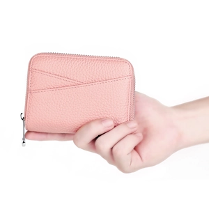 Pink pebbled leather mini wallet with card slots and silver zipper detail