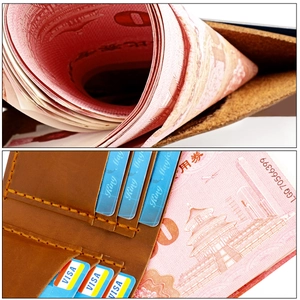 Detail of vintage brown leather wallet with multiple card slots and handmade stitching