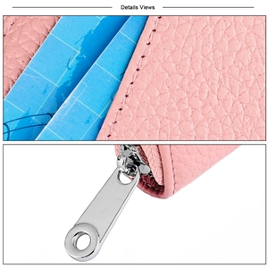 Detail view of pink lychee grain leather card slots and smooth silver metal zipper puller