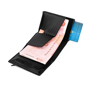 Close-up of carbon fiber leather wallet showing multi-card slots and cash pocket