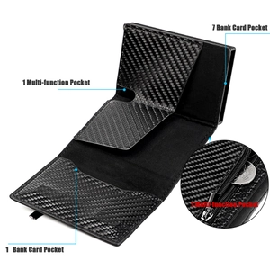 Detail view of carbon fiber wallet showing seven card slots and zipper pocket