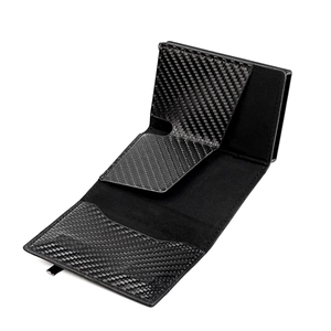 Detail view of tri-fold black leather wallet with RFID blocking card slots and carbon fiber