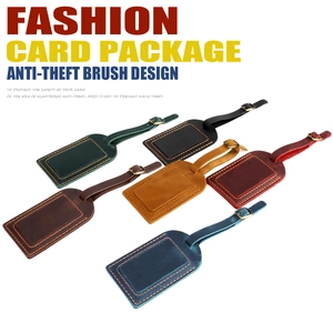 Detail of crazy horse leather luggage tags with anti-theft design and adjustable straps